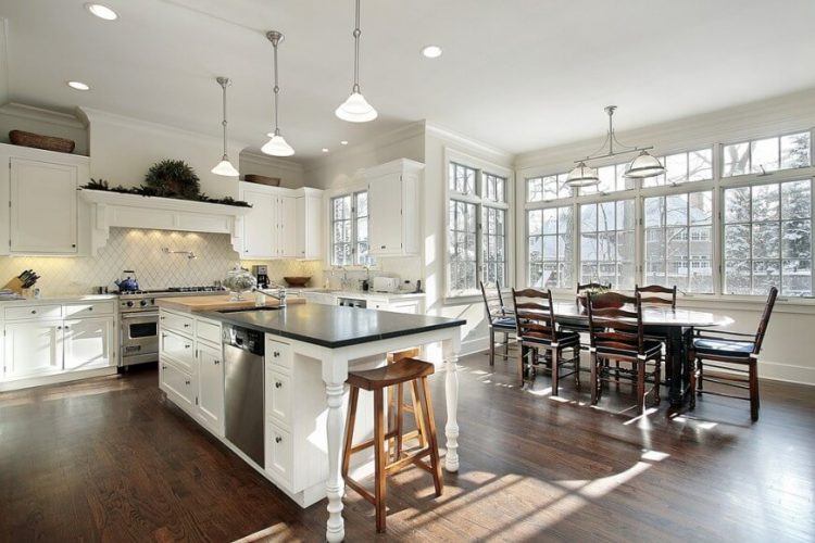 kitchen with wood floors and large windows