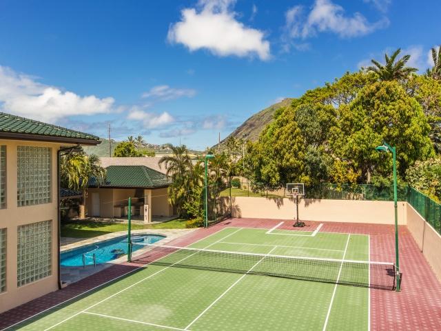 lavish property with tennis court, pool, and basketball hoop