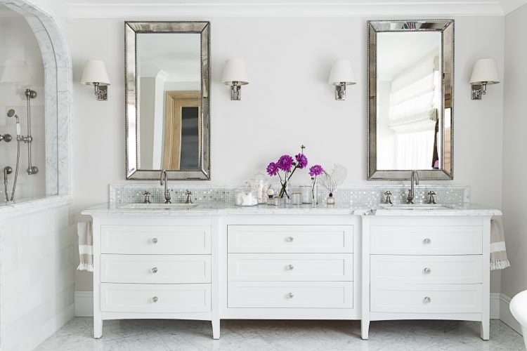 white beach style bathroom with silver mirrors