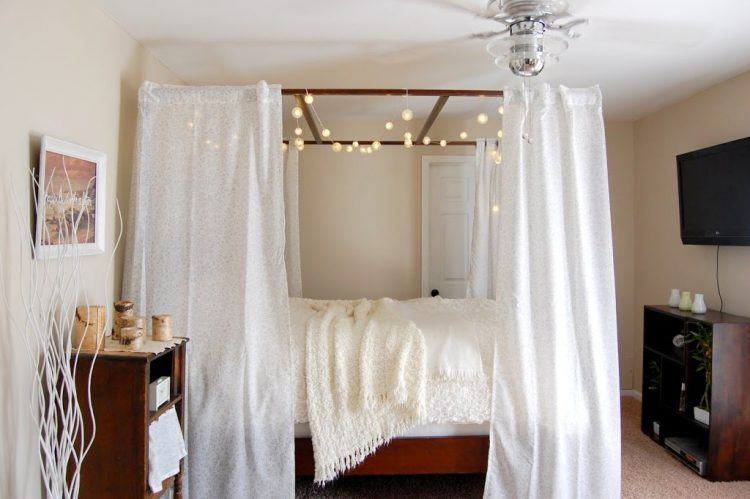 canopy bed with hanging lamps