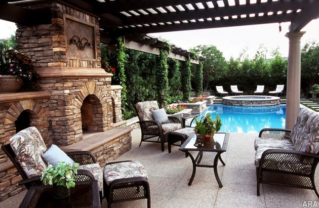 backyard swimming pool with stone fireplace