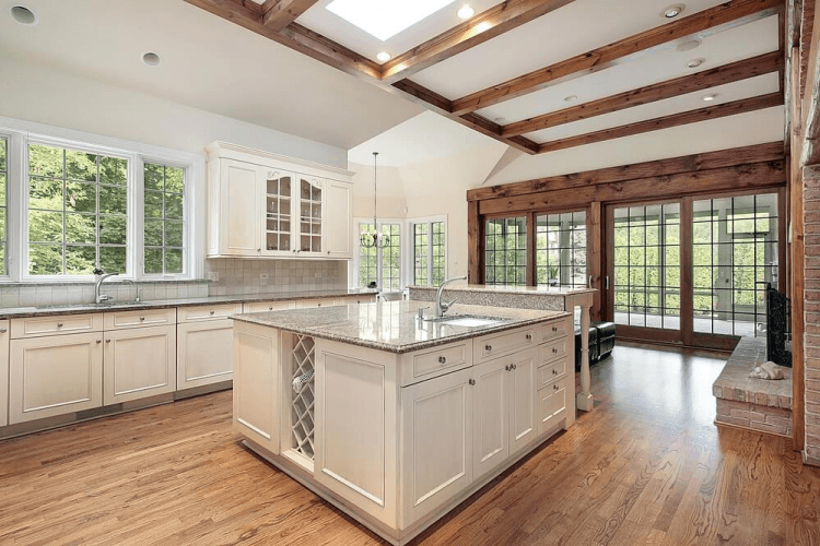 kitchen with hardwood flooring and large white island