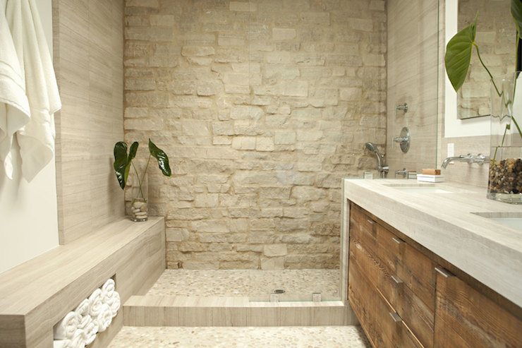 lavish walk in shower with light stone