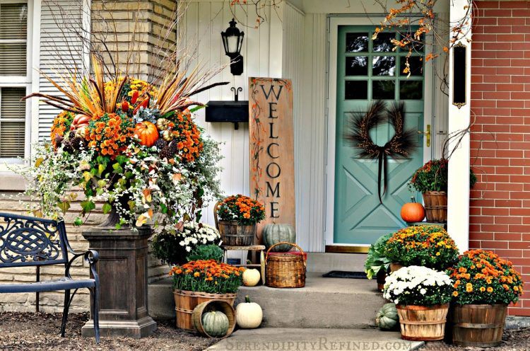 beautiful fall themed porch with welcome sign