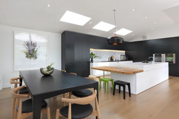 black and white kitchen with wood floor