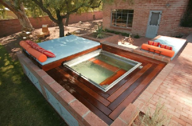 beautiful backyard jacuzzi with wooden platform