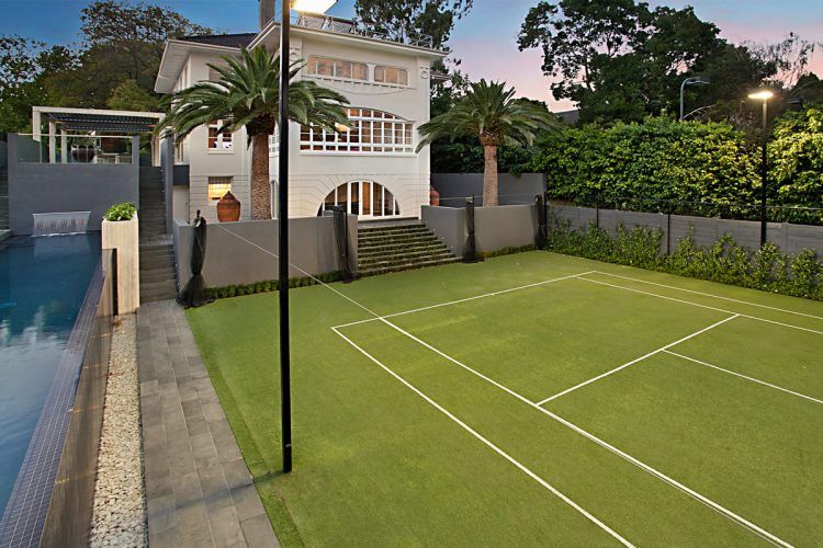 custom home tennis court made of grass