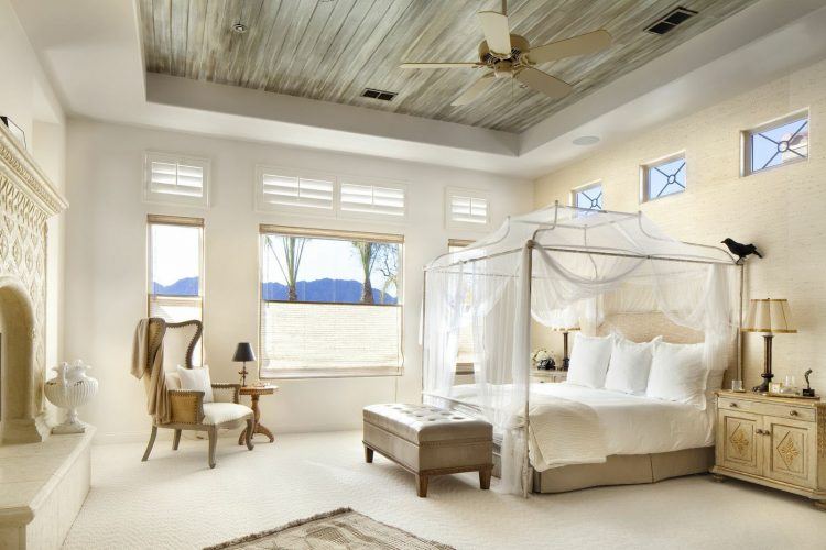 beautiful spacious bedroom with canopy bed