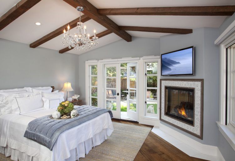 exposed beam vaulted ceiling with chandelier 