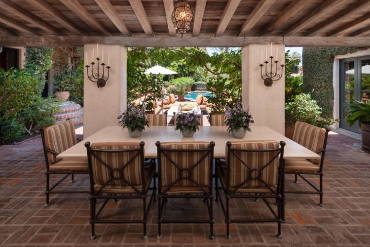 outdoor dining space with large square table