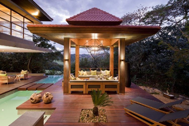 backyard with large wooden canopy and wood patio