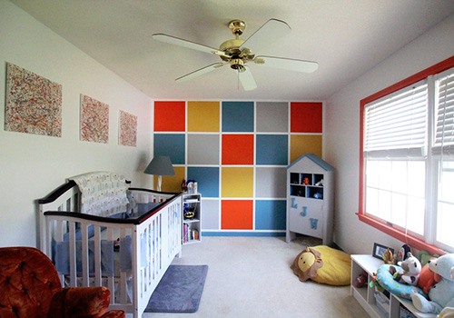 baby nursery with colorful wall