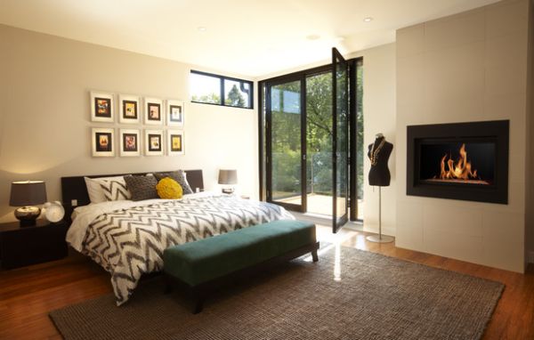 modern master bedroom with doors leading outside