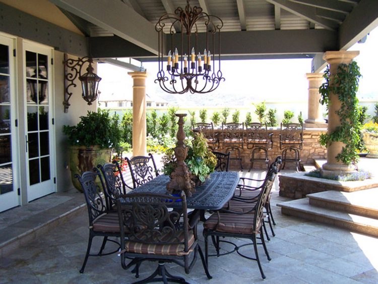 outdoor dining space with chandelier