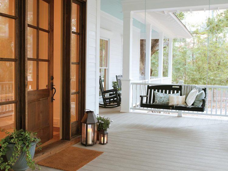 large front porch with black swing