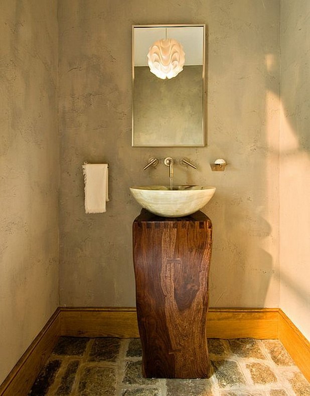 bathroom with wooden vanity and round sink