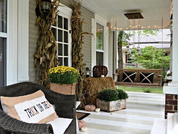 front porch with decorations and wicker furniture