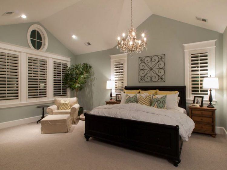 bedroom with classy gold chandelier 