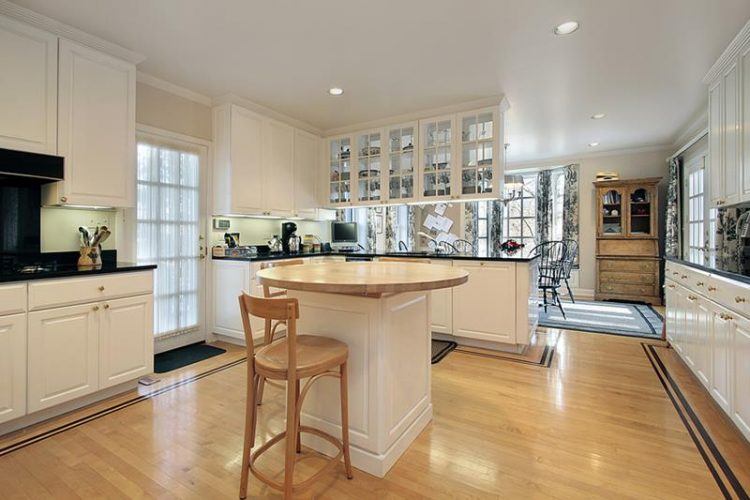 Kitchen with butcher block island in luxury home