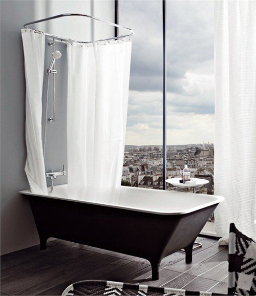 beautiful black bath tub with a view