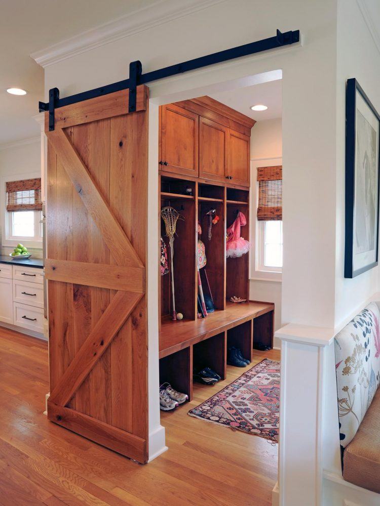 beautiful-wood-sliding-barn-door-feat-long-mudroom-bench-with-shoe-storage-plus-wall-cabinets