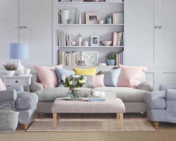 living room with light colored couch pillows