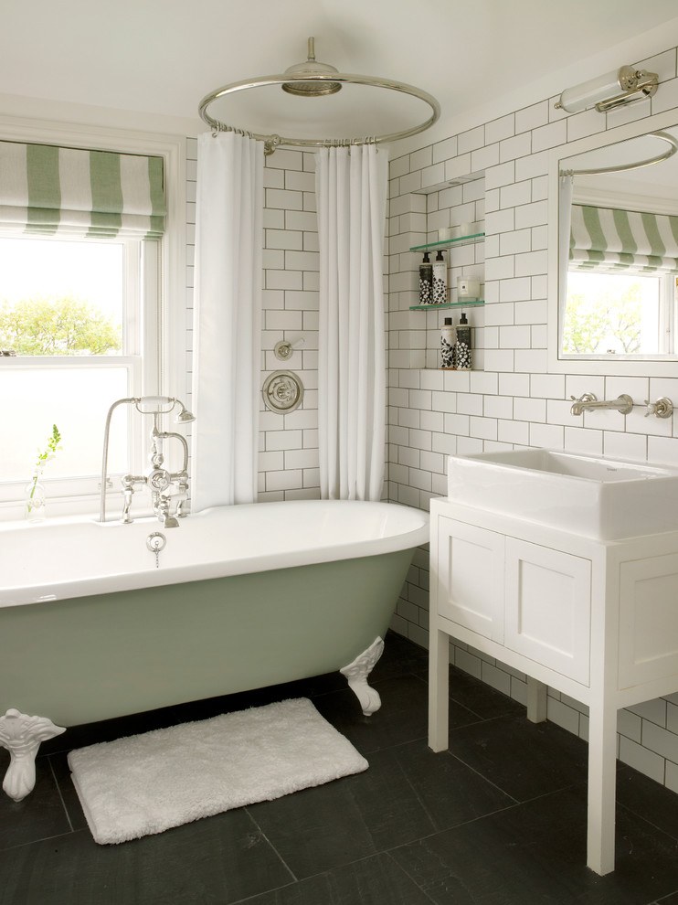 clawfoot bath tub with shower