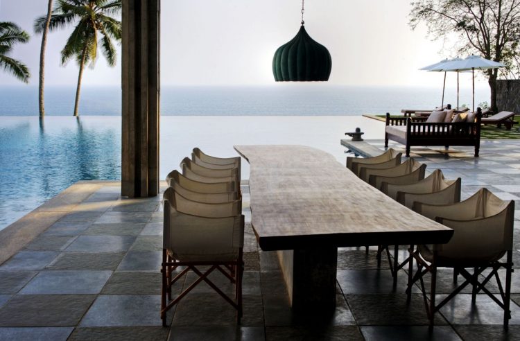 lavish outdoor dining area by the water