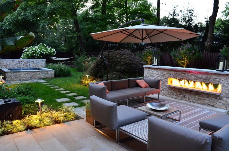 backyard area with living space and fireplace