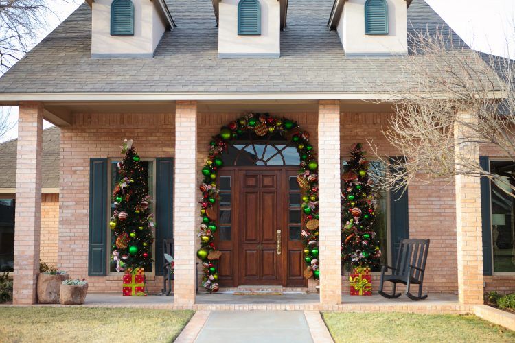 front porch with christmas themed decor