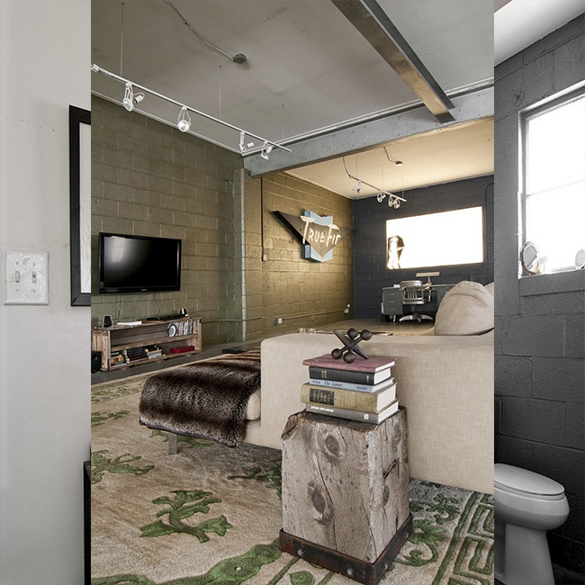 living space with painted brick walls