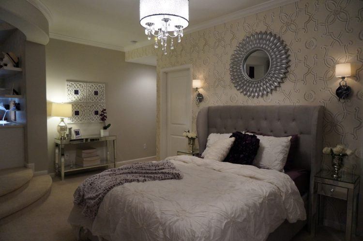 incredible bedroom with hanging light fixture