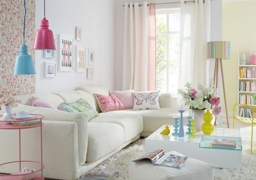 living room with pink hanging lamp