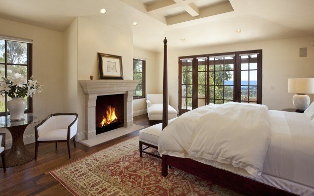 luxury bedroom with classic fireplace