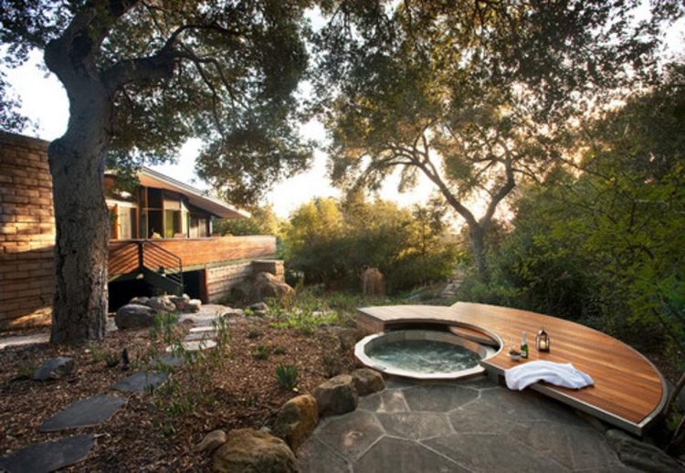 calming backyard with modern hot tub and patio