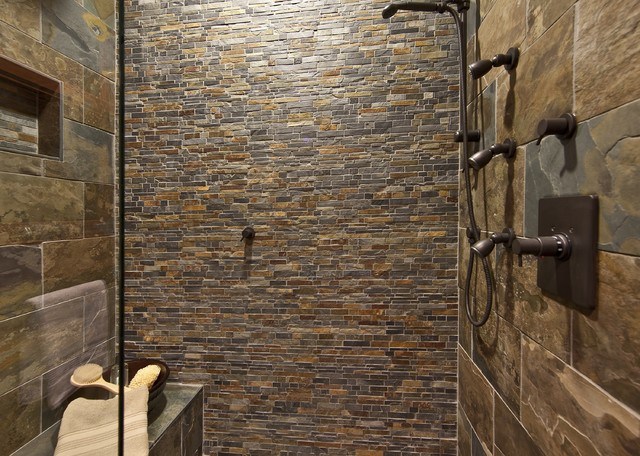 rustic bathroom with mosaic stone shower