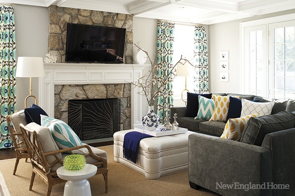 living room with classic stone fireplace