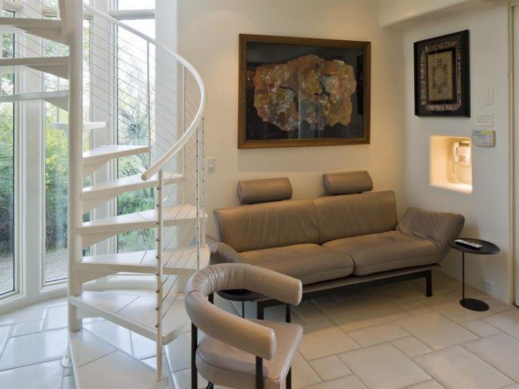 living area with white staircase