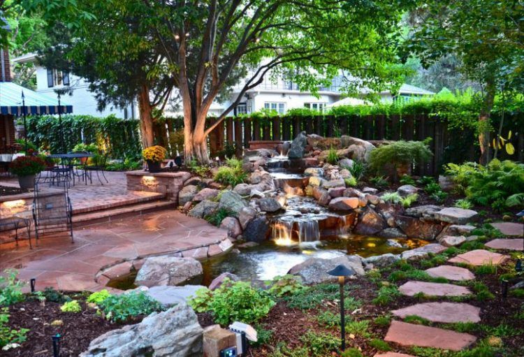 stone paved backyard with fountain