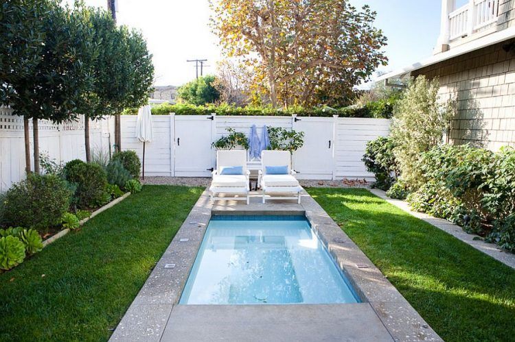 small backyard swimming pool with sitting area