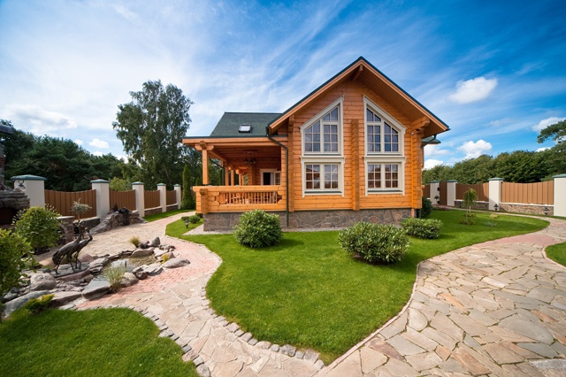 wooden country house with large driveway