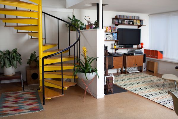 yellow staircase with black railing