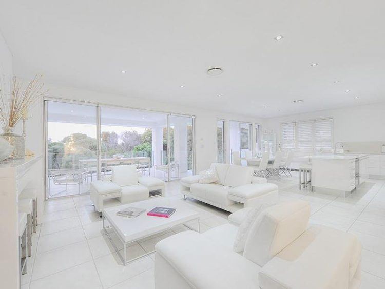 white living room with large windows