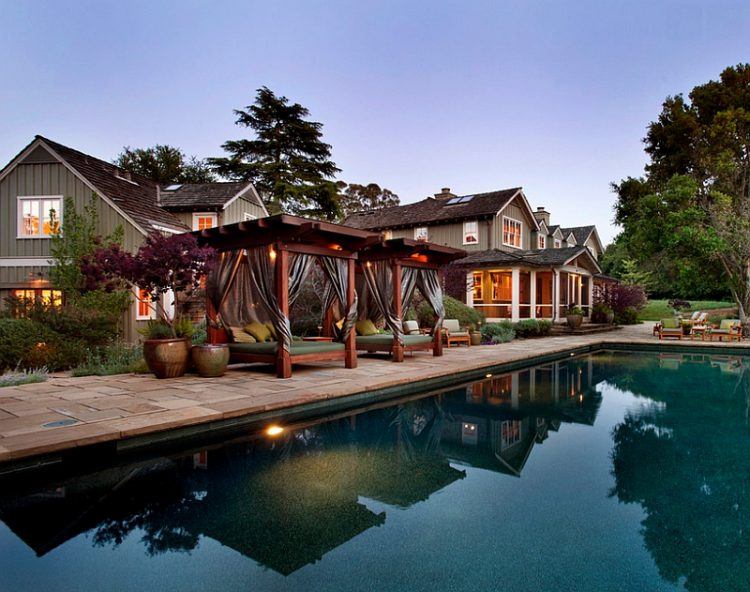 daybed with canopy by the pool