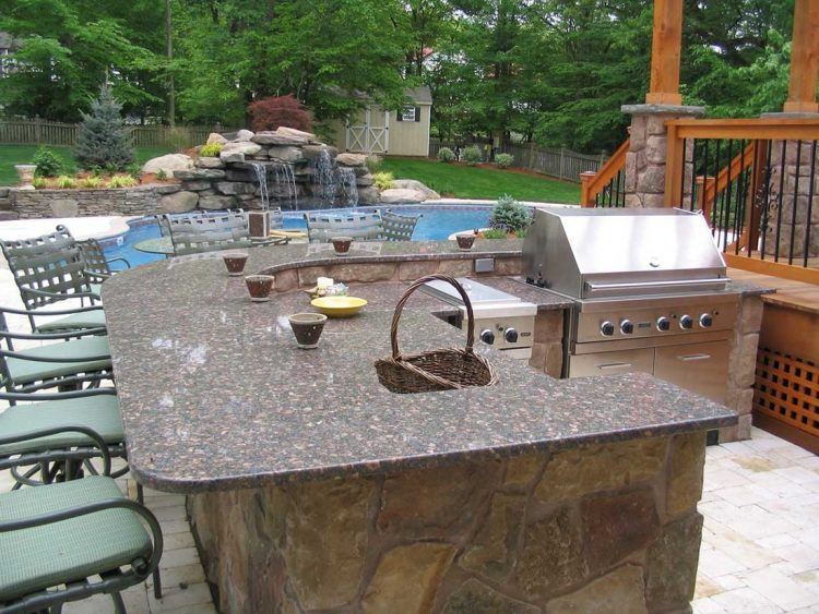 stainless steel kitchen near pool