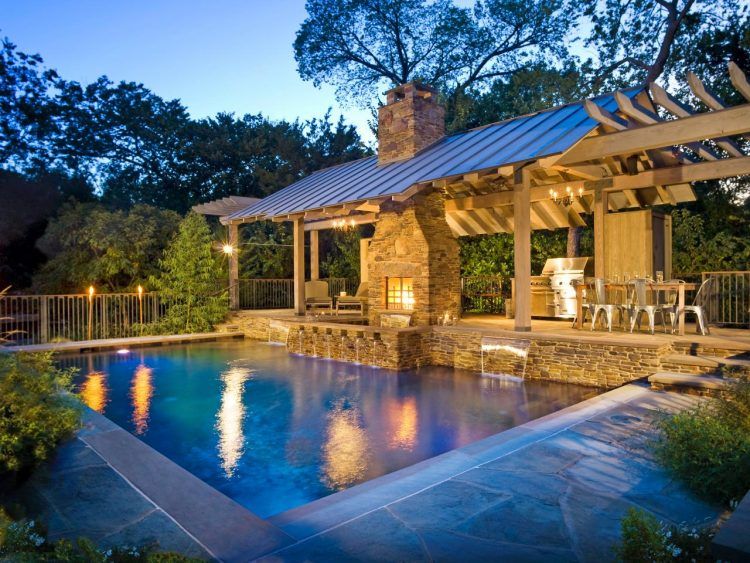 large backyard swimming pool with lights