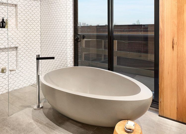 beautiful oval shaped bath tub made of stone