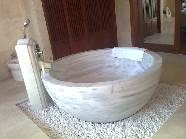 beautiful round soaking tub made of stone