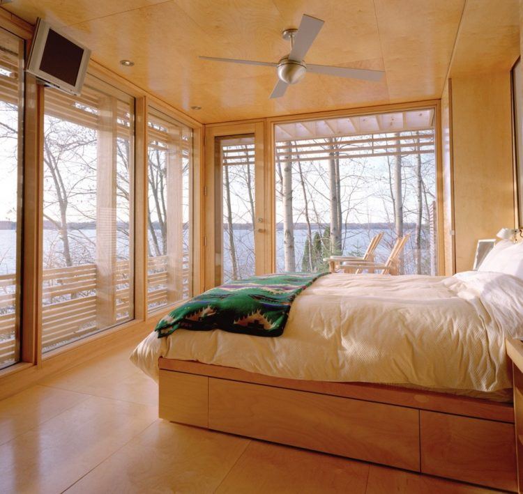 contemporary bedroom with wooden design and ceiling fan