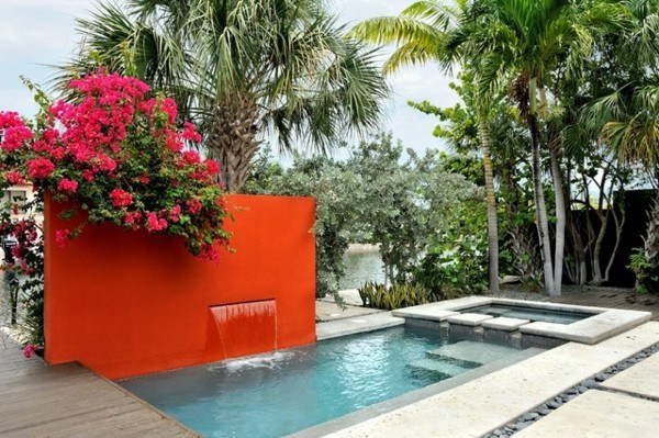 bright red wall near swimming pool